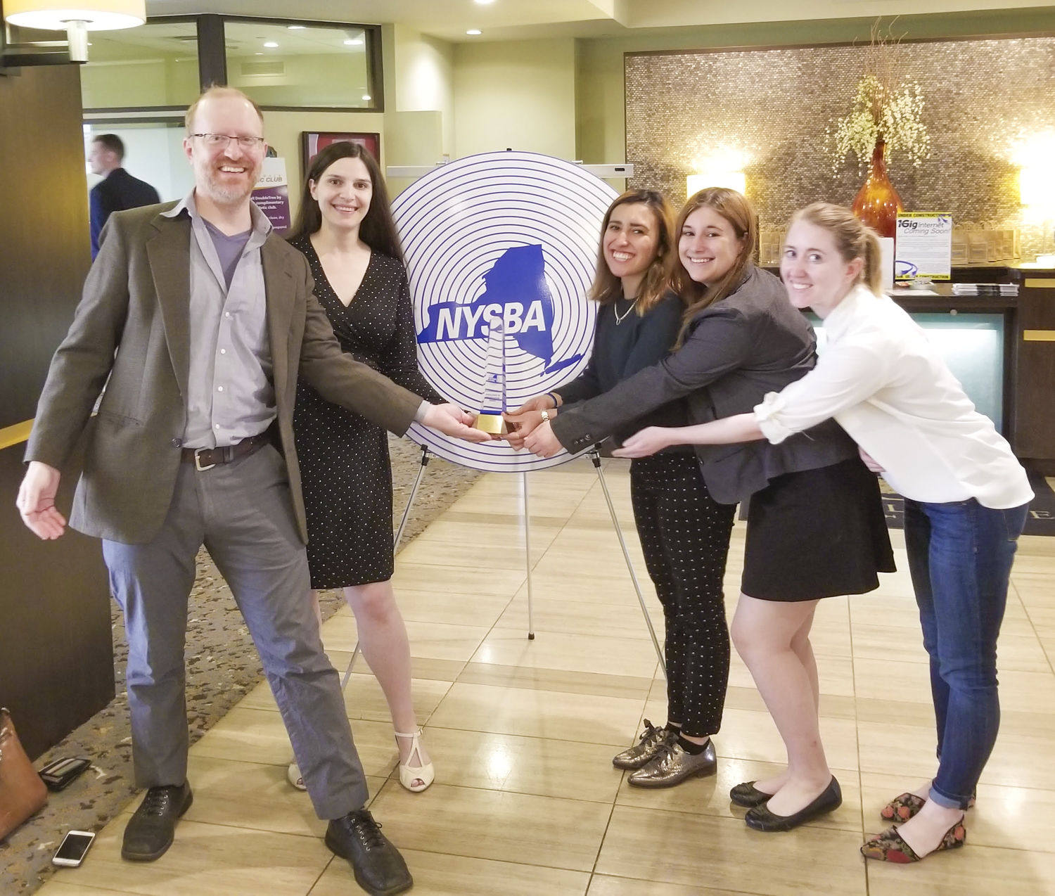 General Manager Felix Teitelbaum, former news director Laura Rosbrow-Telem, Park Scholar collaborators Elena Peich and Skylar Eagle and Kelsey O’Connor of the Ithaca Voice after winning a NYS Broadcasting Association Award. (Photo provided)